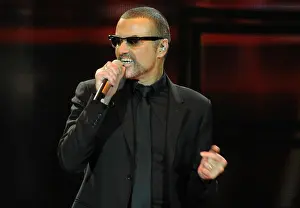 Pose Prints: Singer George Michael is pictured during a concert at the 02 World in Hamburg