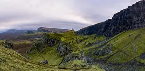 Blue Hill Prints: Single hiker on top of mountain in Rugged volcanic landscape around Quiraing