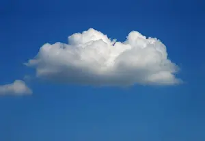 Cumulus Prints: one single white cumulus cloud in the blue sky in summer