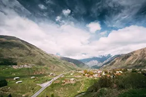 Sioni Village On Mountain Background In Kazbegi District, Mtskheta-Mtianeti Region, Georgia. Spring Or Summer Season