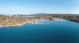 Sithonia Chalkidiki, Greece. Ormos Panagias bay and boat marina aerial drone view, clear blue sky, sunny summer day