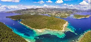 Sivota - stunning aerial drone video of turquoise sea known as Blue Lagoon and unique beach Bella Vraka. Epirus, Greece