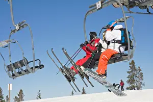 Ski Resort Prints: Skiers and snowboarder, riding the chairlift, Winter Park Resort, Colorado, USA