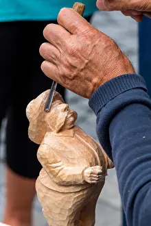 Carpenter Prints: Skillful carver working in a small figure