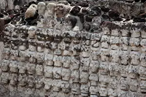 Aztec Prints: skull rack, or tzompantli sculpture at the ancient Aztec archaeological site of Templo Mayor in downtown Mexico City
