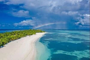 Images Dated 25th May 2019: Sky and sea with aerial island landscape rainbow. Fantastic aerial landscape in Maldives islands