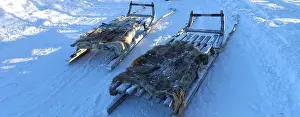 Blue Ice Prints: Sleds parked on the snow in the north of Sweden