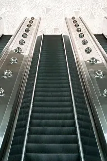 Commute Prints: A sleek, stainless steel escalator in the Tashkent metro