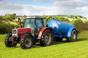 Slurry spreading with a vacum tanker on back of a Massey Ferguson 6180