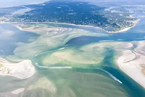 Great White Sharks Prints: Small boats navigate a channel between sand islands on Cape Cod