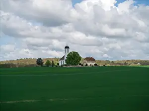 Fruit Tree Prints: Small church with cemetery in the middle of blooming fruit trees and fields captured with a drone in spring