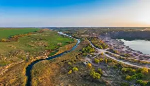 Abundant Prints: A small fast stream Kamenka in the wilderness in the evening light in Ukraine