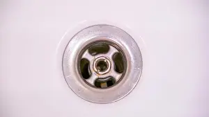 Domestic Room Prints: The small hole of the bathtub inside the bathroom where the water is being drained out