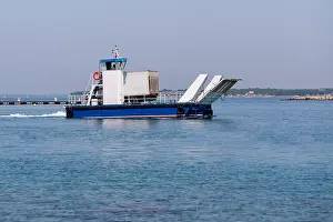 Small local ferry for one car or small truck connecting nearby islands with the mainland