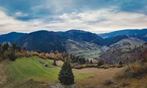 Small village in a mountain valley of the Carpathian Mountains on an autumn day in Ukraine in the village of Dzembronya