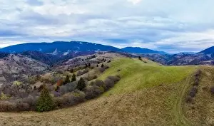 Small village in a mountain valley of the Carpathian Mountains on an autumn day in Ukraine in the village of Dzembronya