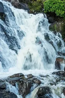 Flooding Prints: Small waterfall near Ffestiniog in North Wales with a torrent of water flowing over due to a period of heavy rain