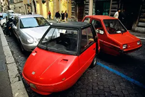 Transportations Prints: Smart cars parked on a street in Rome Italy