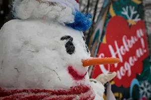 Snowfall Prints: a smart snowman stands in the park on the new year's eve in Moscow, Russia