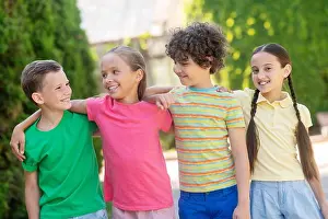 Having Fun Prints: Smiling boys and girls standing hugging
