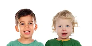 Imagine Prints: Two smiling children with different races isolated on a white background