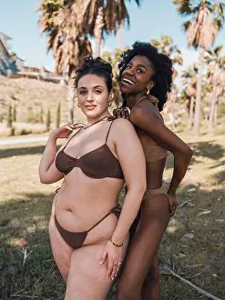 Beautiful Woman Prints: Smiling friends wearing bikini standing in park