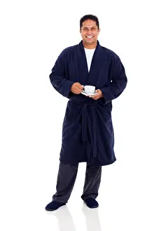 Pajamas Prints: smiling indian man in pajamas drinking coffee in the morning