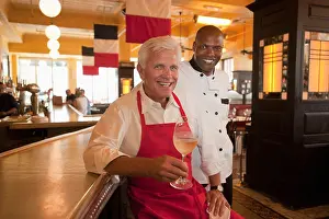 Unwinding Prints: Smiling restaurant waiter and chef