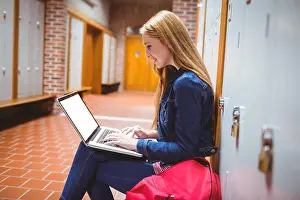 Higher Education Prints: Smiling student sitting at the computer