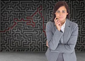 Well Dressed Prints: Smiling thoughtful businesswoman against grey maze