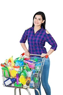 Creative Ideas Prints: Smiling Young Lady Standing with shopping cart full dairy grocery