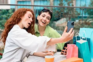 Cashless Prints: smiling young women girlfriends having a fun time together
