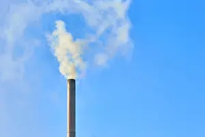Coal Prints: Smoke comes from the chimney of the house