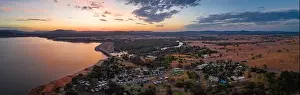 Murray River Prints: Smooth water surface of scenic lake and beautiful countryside village at dusk - wide aerial panorama