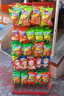 Dinodia Prints: Snacks rack with packets of junk food Kurkure and Lays wafers India