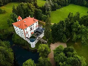 White Castle Prints: Sneznik Castle in Slovenia, Picturesque Flowing Castle in Park with Pond
