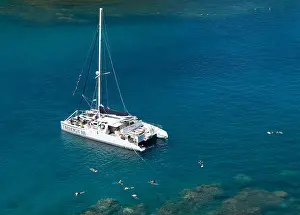 Unspoiled Prints: Snorkelers swim from the Trilogy 111Catamaran in Honolua Bay Marine Reserve, Maui, Hawaii