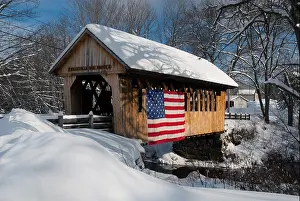 American Flag Prints: Snow covered bridge displays patriotism in New Hampshire