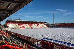 Wintery Prints: Snow covered football / soccer pitch in wintery scene at English football ground