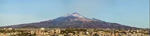 Urban Skyline Prints: Snow covered Mount Etna volcano and Catania city center at sunrise