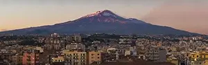 Catania Prints: Snow covered Mount Etna volcano and Catania city center at sunset