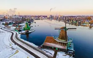 Cold Weather Prints: Snow at the Zaanse Schans windmill village during winter with snow landscape in the Netherlands Holland village