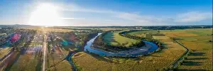 Snowy River bends and Orbost township at sunset - wide aerial panorama