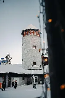 Boreal Prints: Snowy wildlife park entrance tower behind fairy lights in Ranua, Lapland