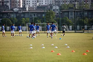 Soccer Club Prints: Soccer players of Shanghai Shenhua FC exercise during a training session at Shanghai Shenhua Football Training Centre