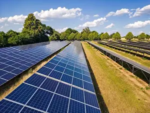 Solar Panels Prints: Solar panels of an open space installation with photovoltaic modules on an agricultural field on a day with sunshine