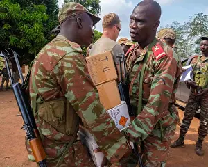 Munitions Prints: Soldiers from the Benin 1st Commando Parachute Battalion prepare to distribute simulation munitions ahead of a field