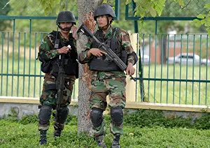 Phnom Prints: Two soldiers of the Cambodian army with sub-machine guns, Phnom Penh, Cambodia