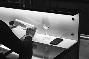 Toast Prints: Sommelier, cavist. Wine glass in hand checking wine on white background