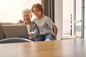 Demonstrating Prints: Son and his dad spending time together